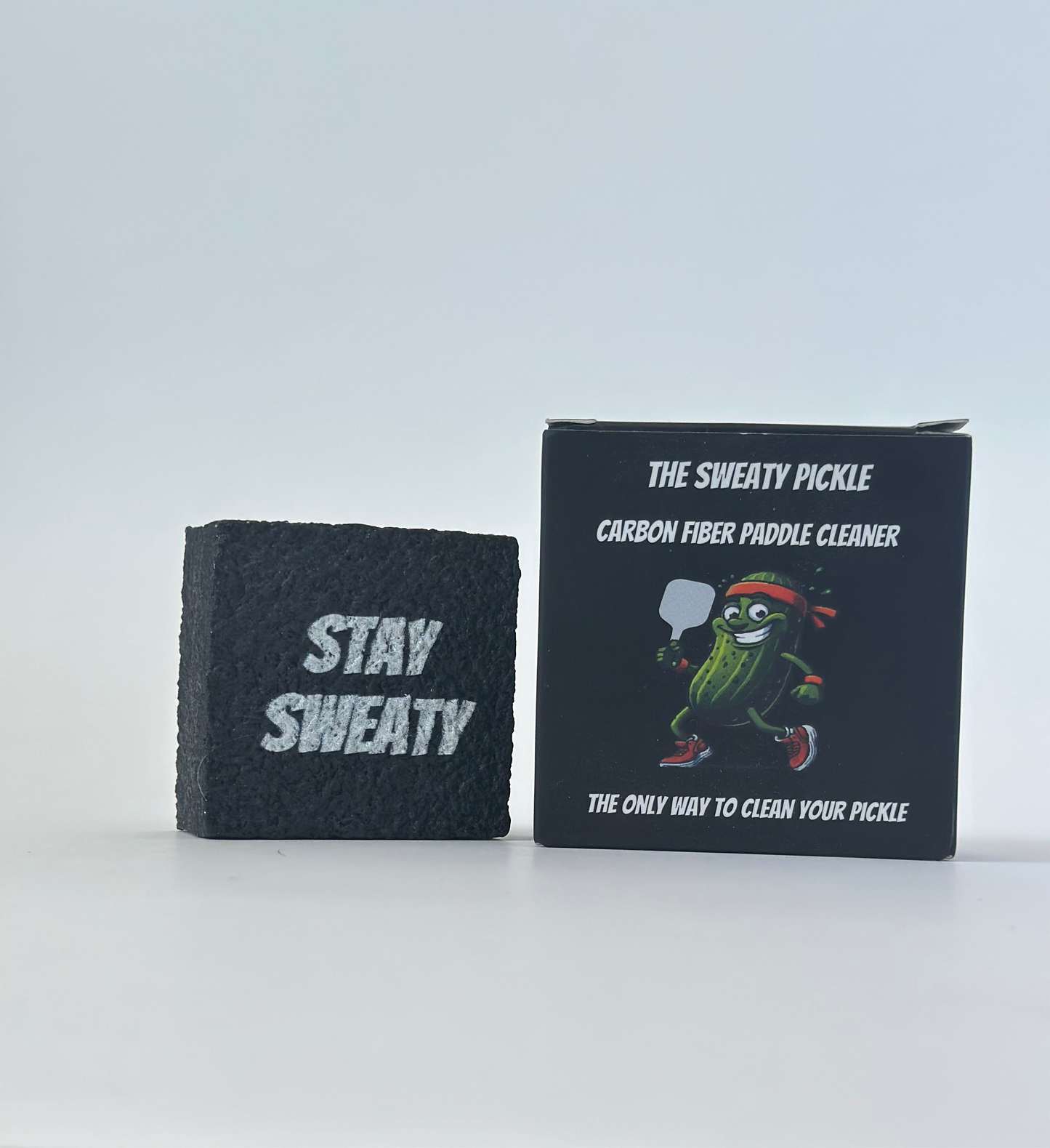 Close-up showing textured surface of the paddle cleaner with funny box